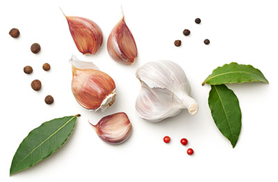 Garlic, Bay Leaves, Allspice and Pepper Isolated on White Background